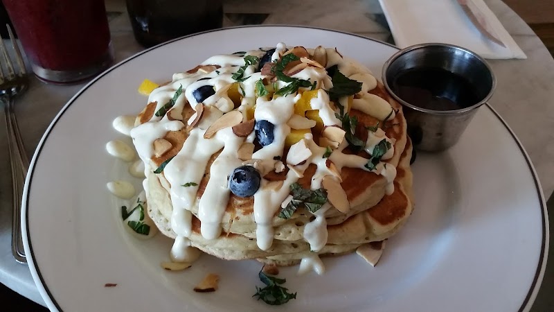 Butterscotch Pancakes covered with blueberries and syrup